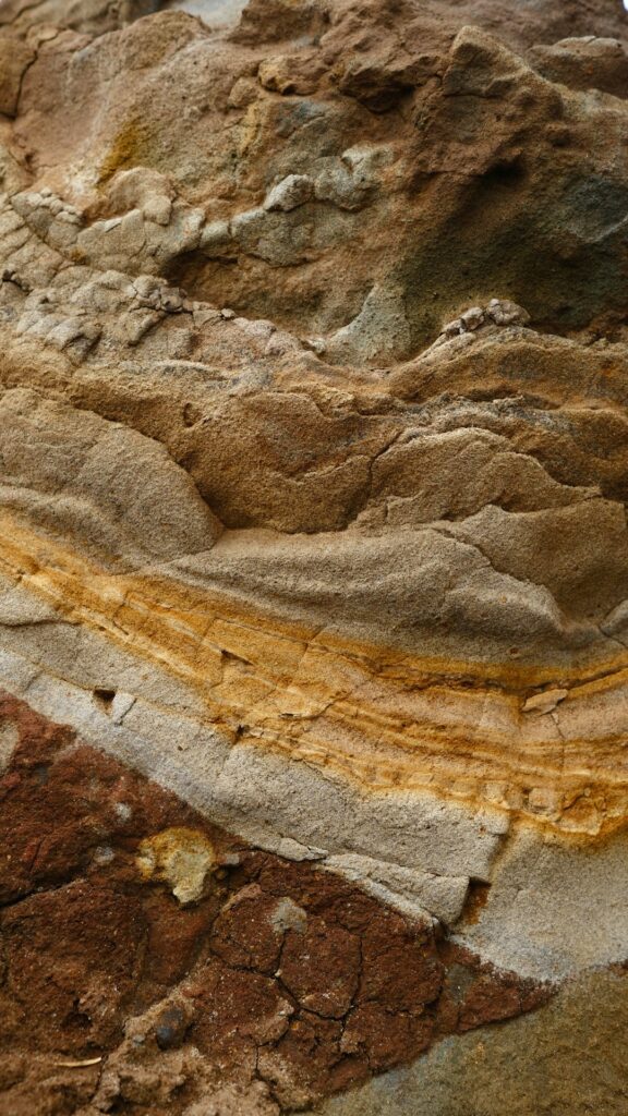 a close up of a rock with a yellow line on it