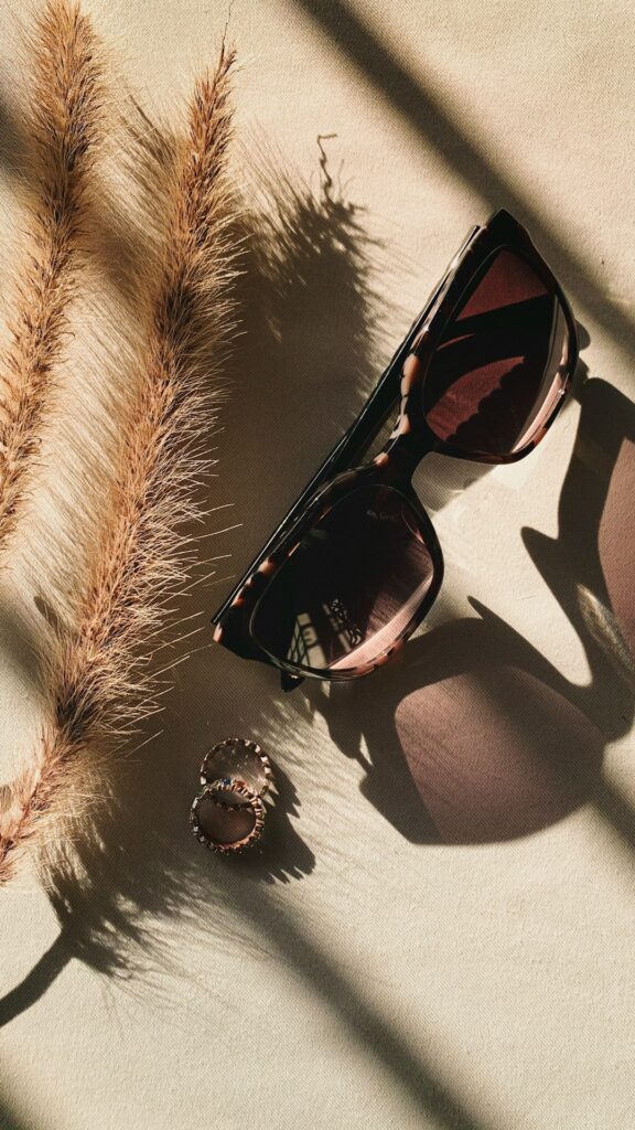 black framed sunglasses on white and black textile