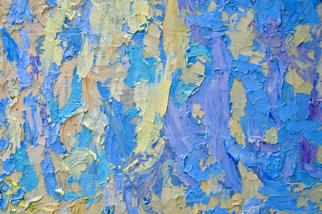 Abstract textured painting with blue and yellow strokes